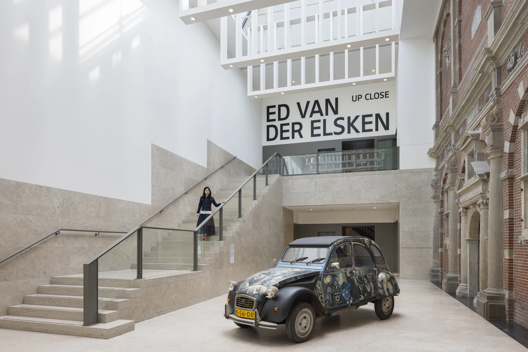 Entrance of the Ed van der Elsken exhibition Up Close in the Rijksmuseum Philips Wing, with the photographer's photo-covered Citroen 2CV