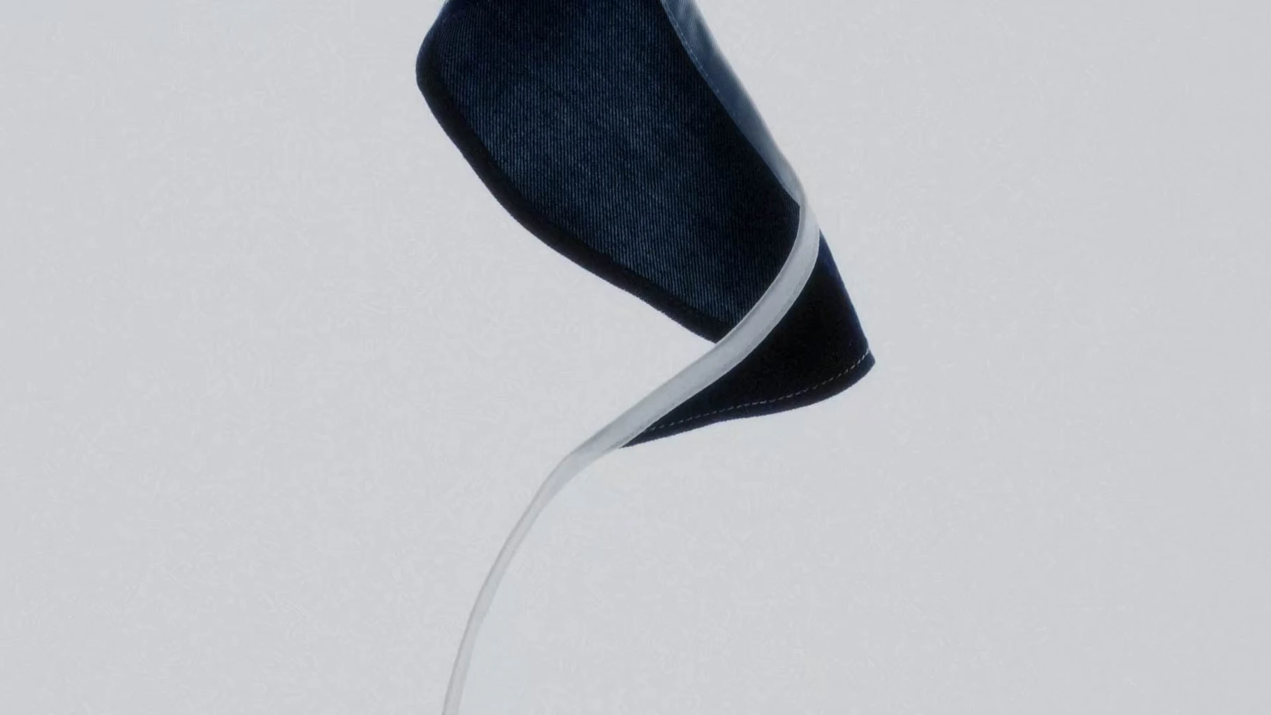 Acne Studios x Hussein Chalayan capsule campaign image showing reworked garment on model