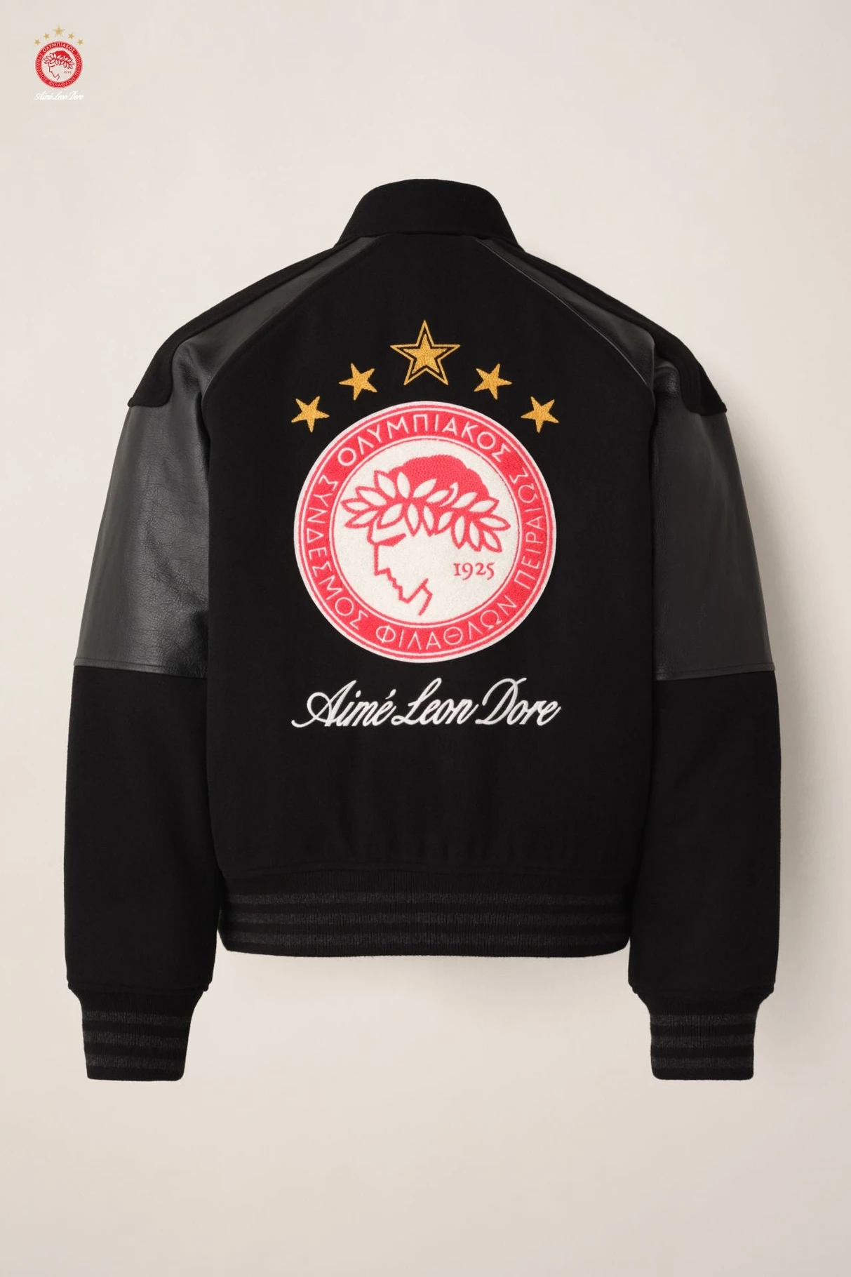 Aimé Leon Dore Olympiacos F.C. team jacket in jet black, laid flat with crest detail visible
