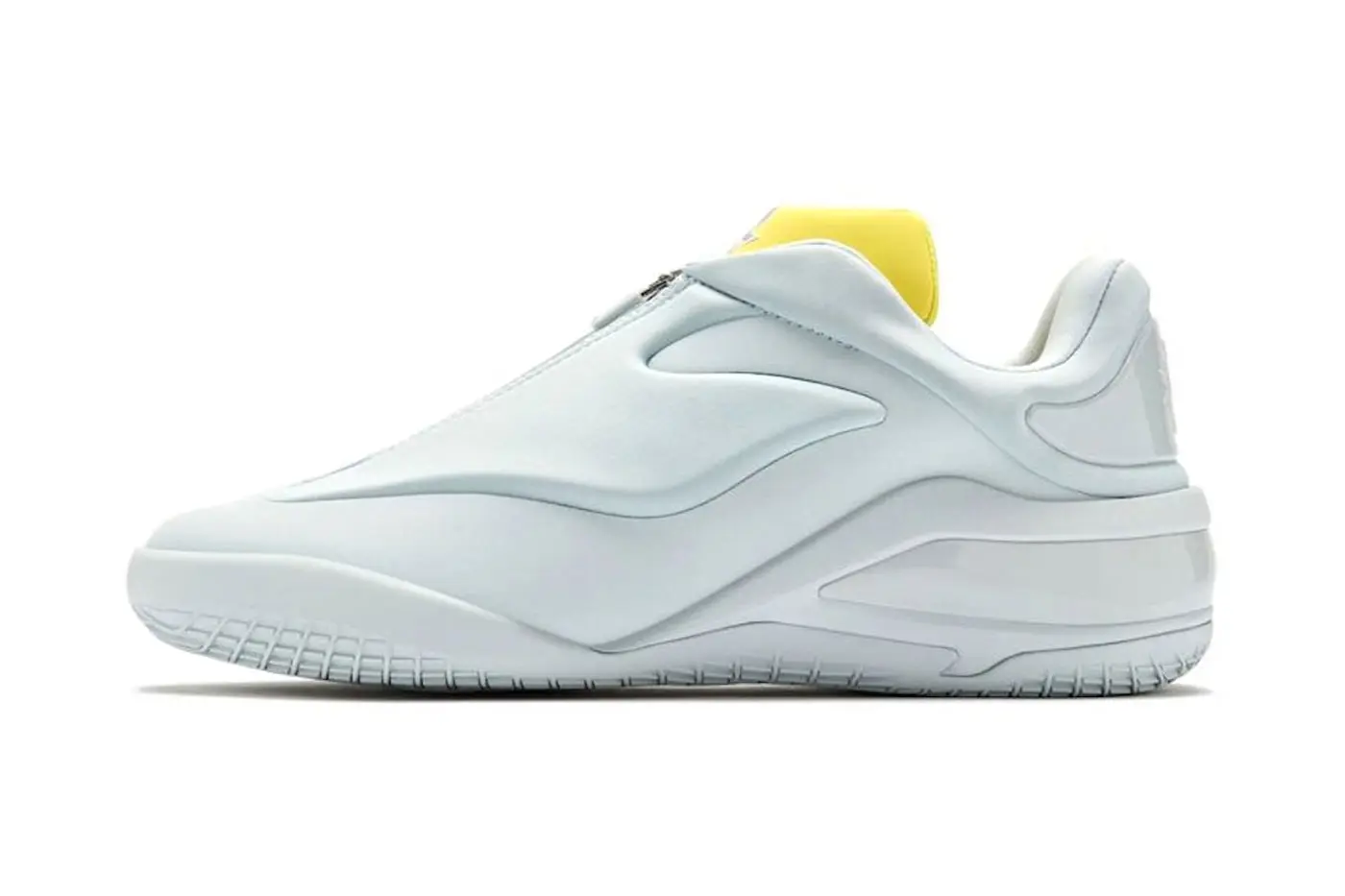 Side profile of the Converse SHAI 001 in white with a Dream Yellow zippered tongue accent