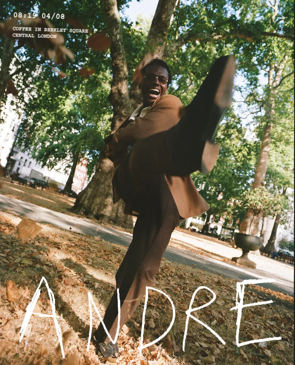 Tan overcoat styled against a wet London pavement in Drake's Autumn Collection Part One lookbook