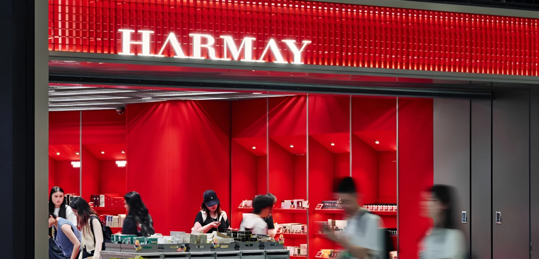 HARMAY store interior at Hangzhou Xiaoshan Airport with red cabin-inspired design