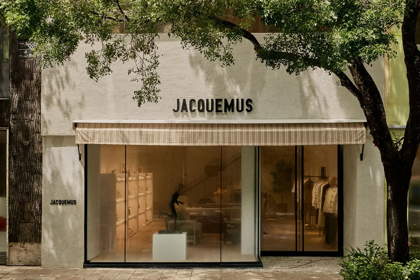 Low stone-clad two-story facade of the Jacquemus Miami Design District flagship