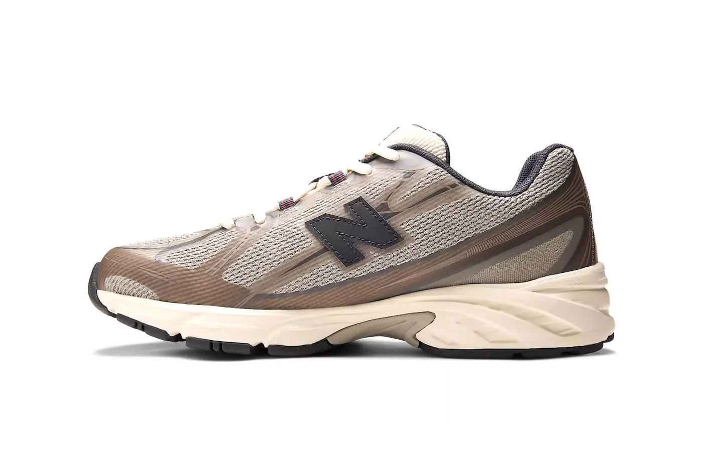 Side profile detail of JJJJound x New Balance 740N showing mesh texture and synthetic overlay construction
