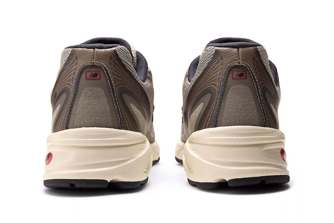 Rear three-quarter view of JJJJound x New Balance 740N Stoneware showing heel counter and midsole profile