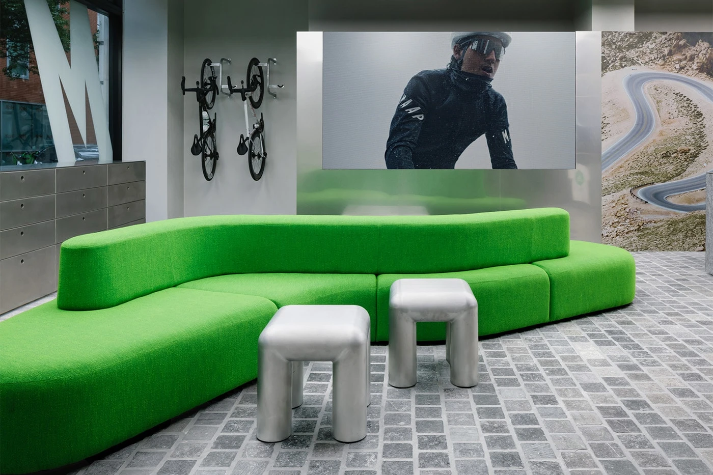Apparel displayed on fixtures inside MAAP's Soho retail space