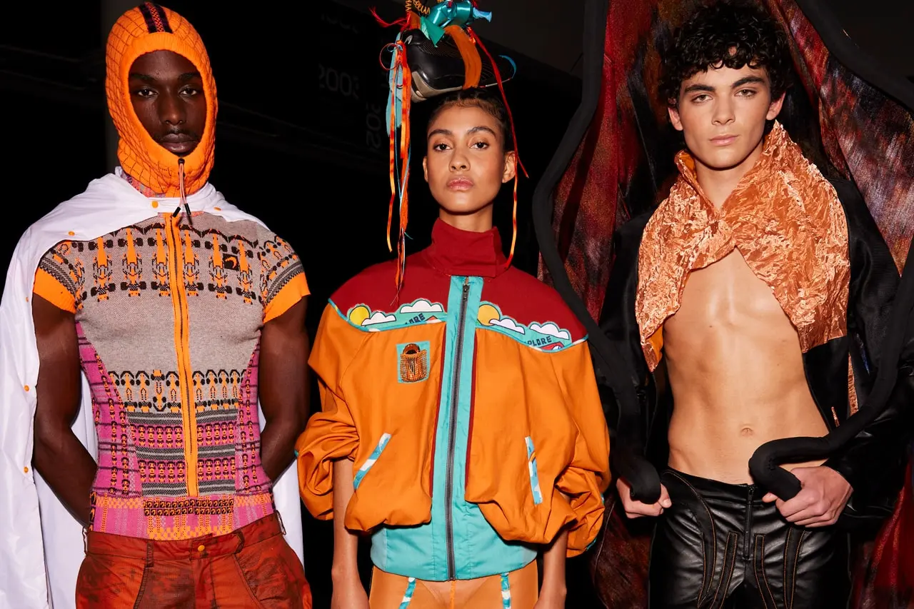 A look from the Designed to Race runway show at McLaren Technology Centre, student-designed garment referencing McLaren's papaya racing livery