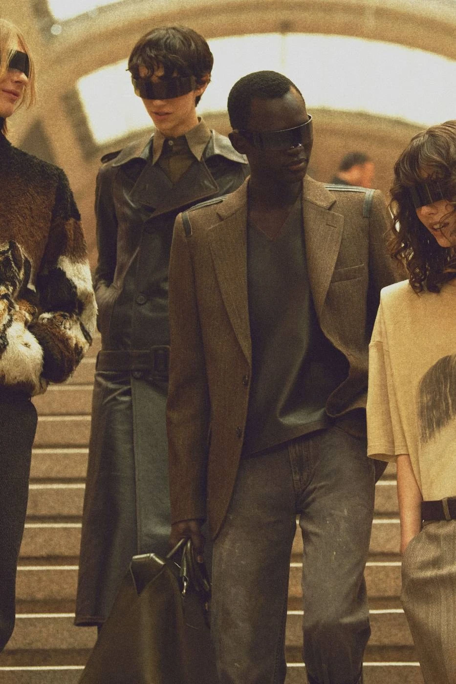 MM6 FW26 campaign image with model wearing colorful concealing sunglasses
