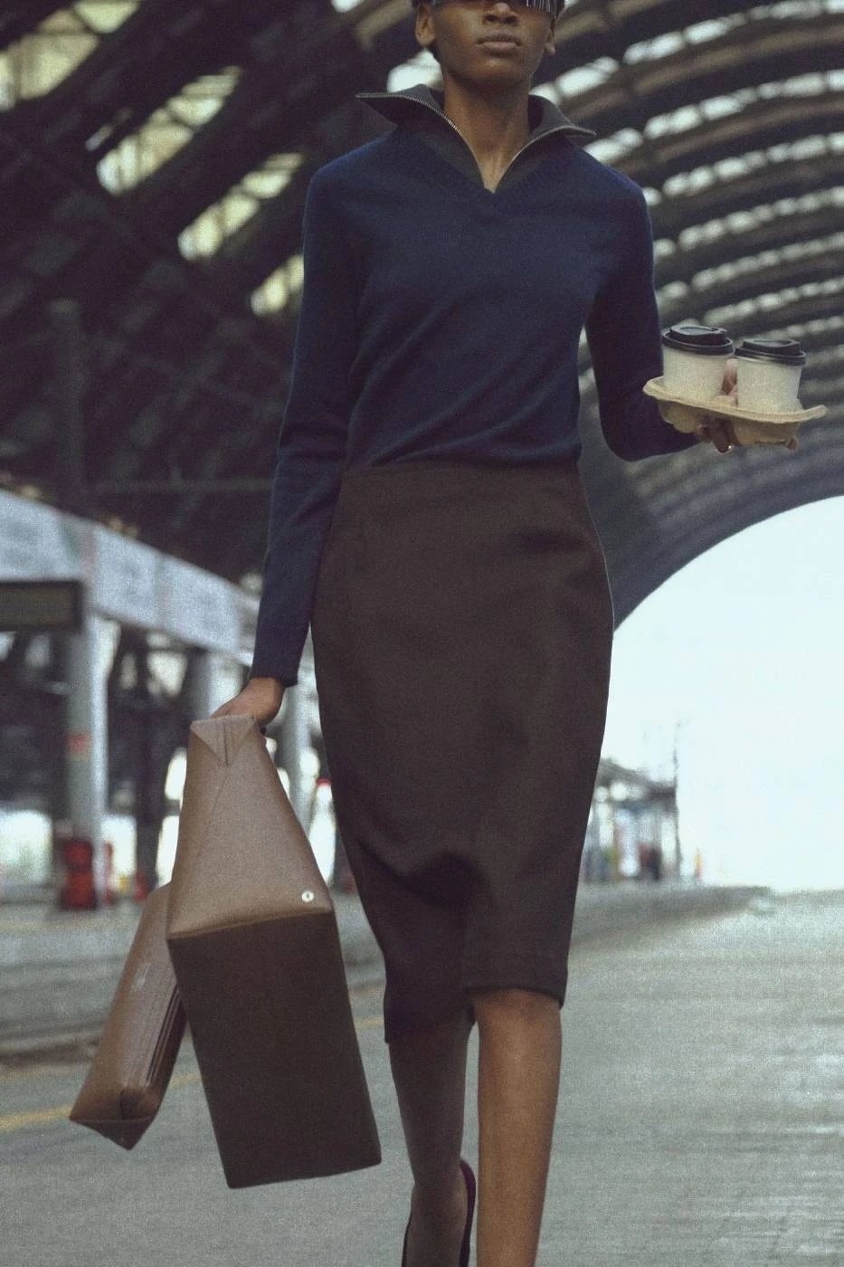 MM6 FW26 campaign image showing a Bauletto bag styled with distorted proportions