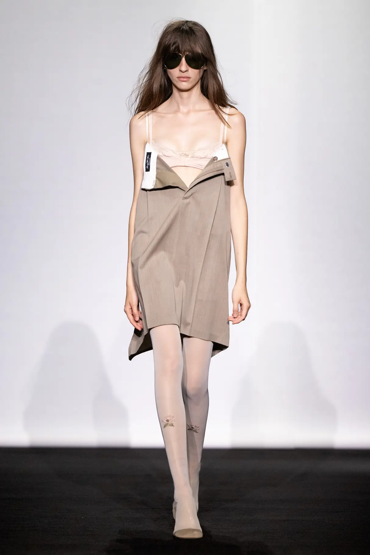 Model on the MM6 Maison Margiela SS27 runway wearing the Havaianas collaboration footwear