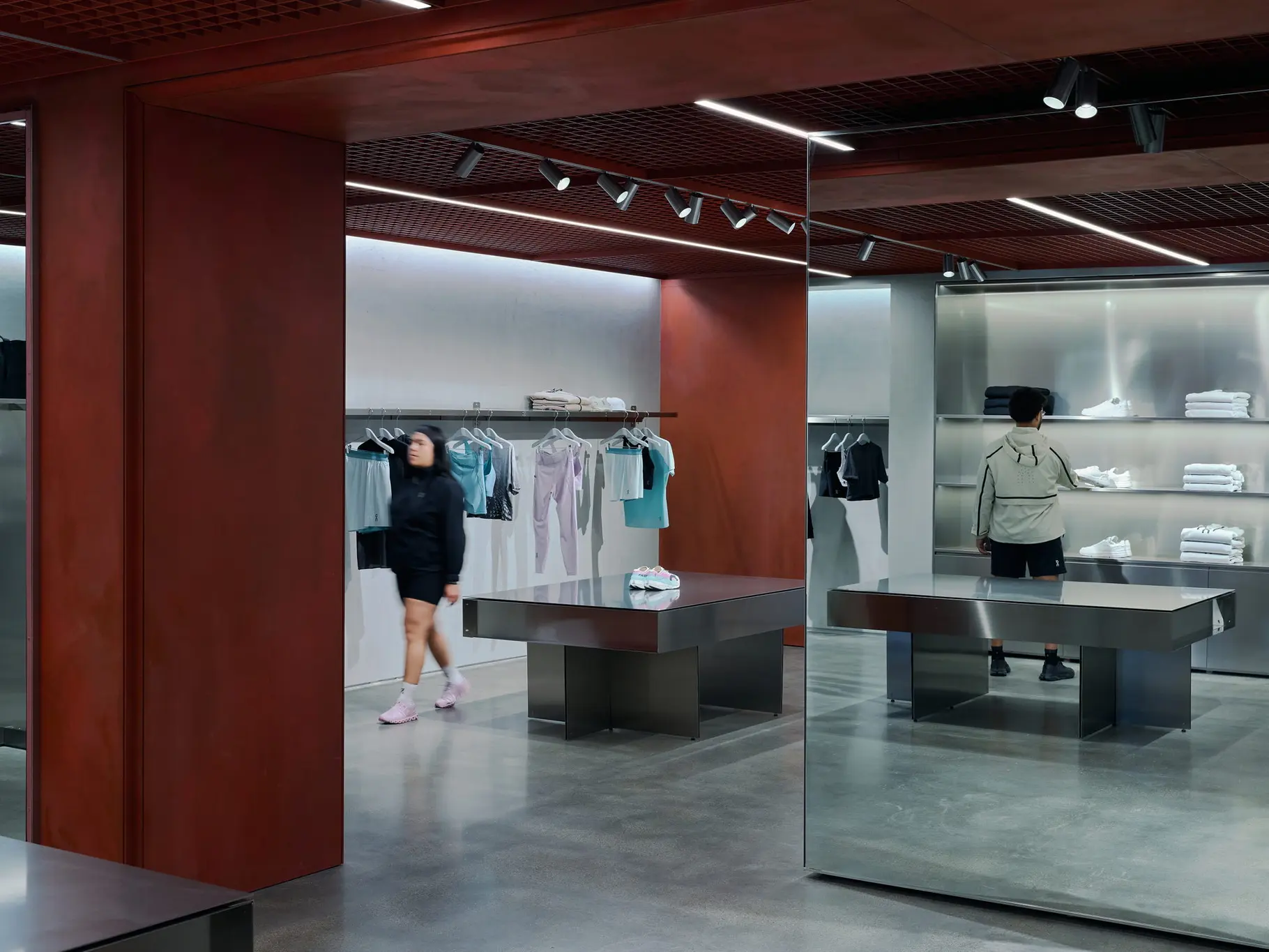 Additional interior angle of On's Chestnut Street store showing shelving and merchandising.
