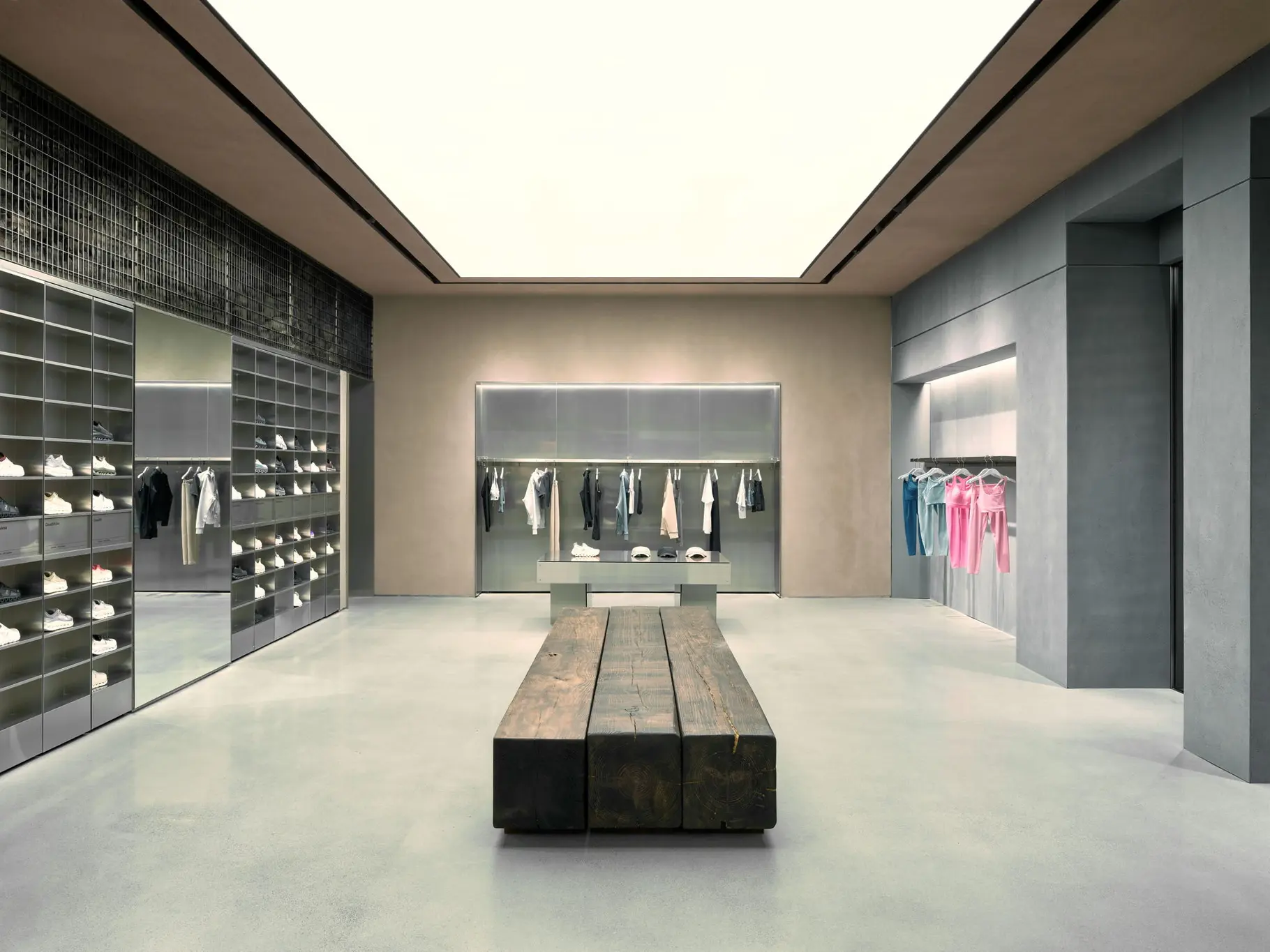 Interior of On's new retail store at NorthPark Center in Dallas, showing shoe displays within a minimalist storefront