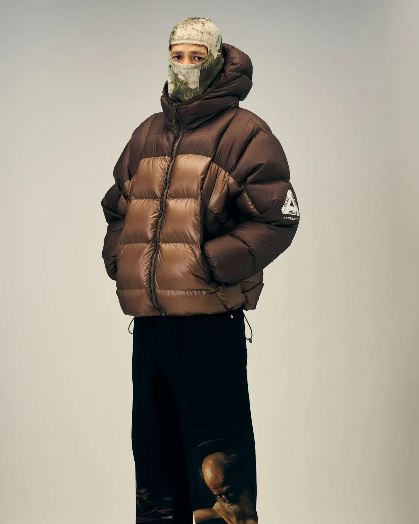 Model wearing a heavy shearling-collared flight jacket, opening look of Palace's Winter 2026 lookbook
