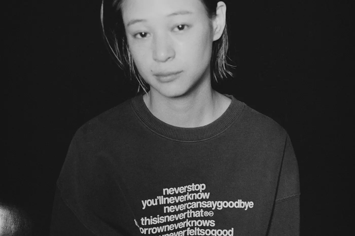 Fleece crewneck with the neverenough graphic and fragment design's double lightning bolt sharing a spine