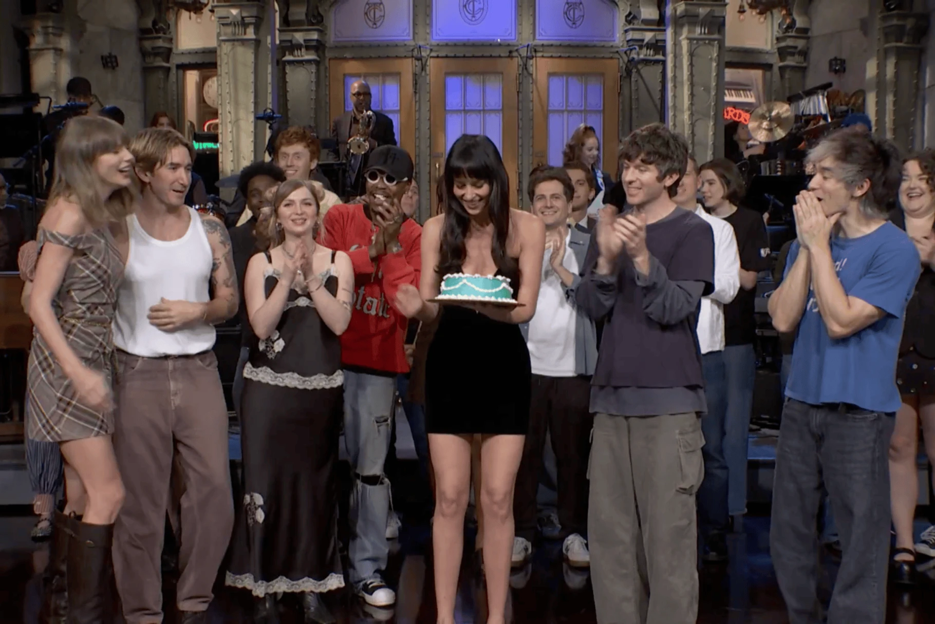 Turnstile performing on the Saturday Night Live stage with Taylor Swift appearing alongside the band