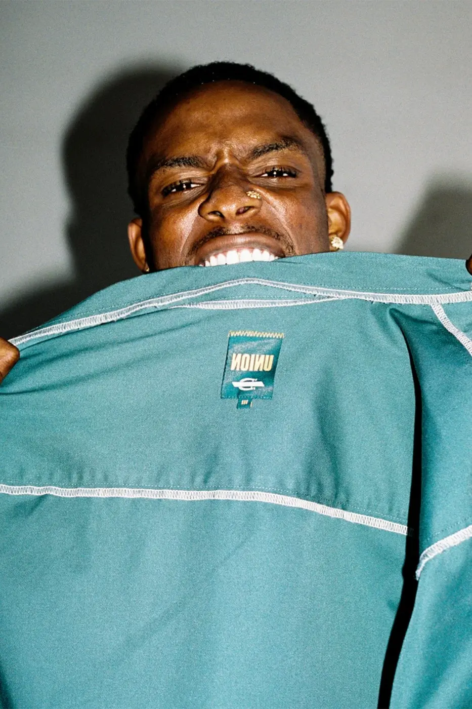 Detail shot of contrast stitching across an INVERSE capsule garment