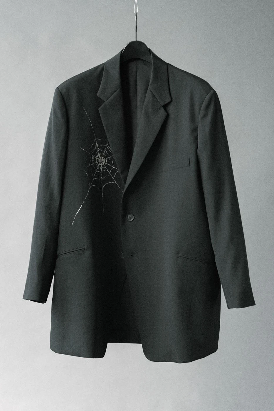 Detail shot of the spider web discharge pattern on wool gabardine