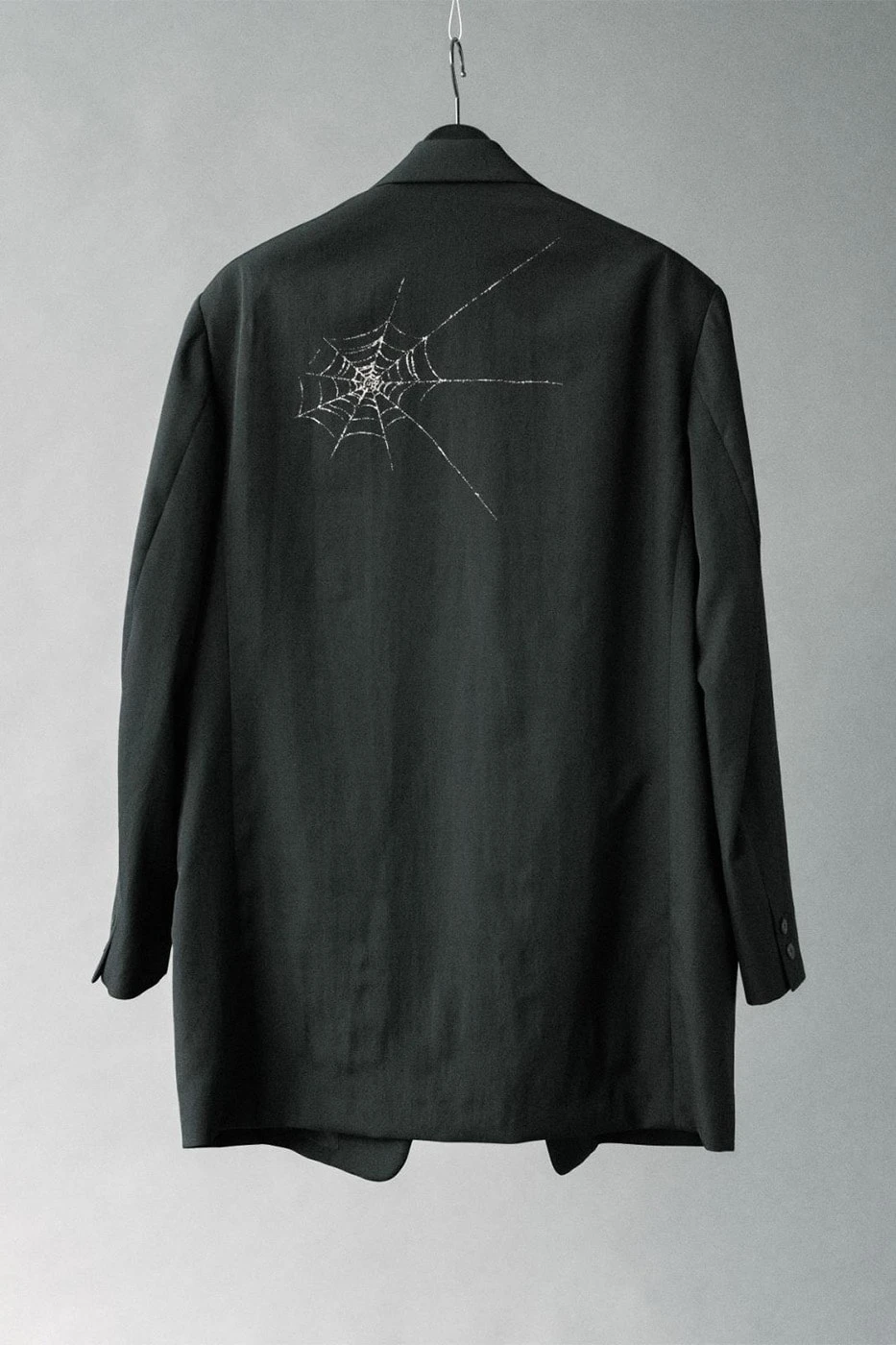 Oversized shirt from the capsule shown on a standing model
