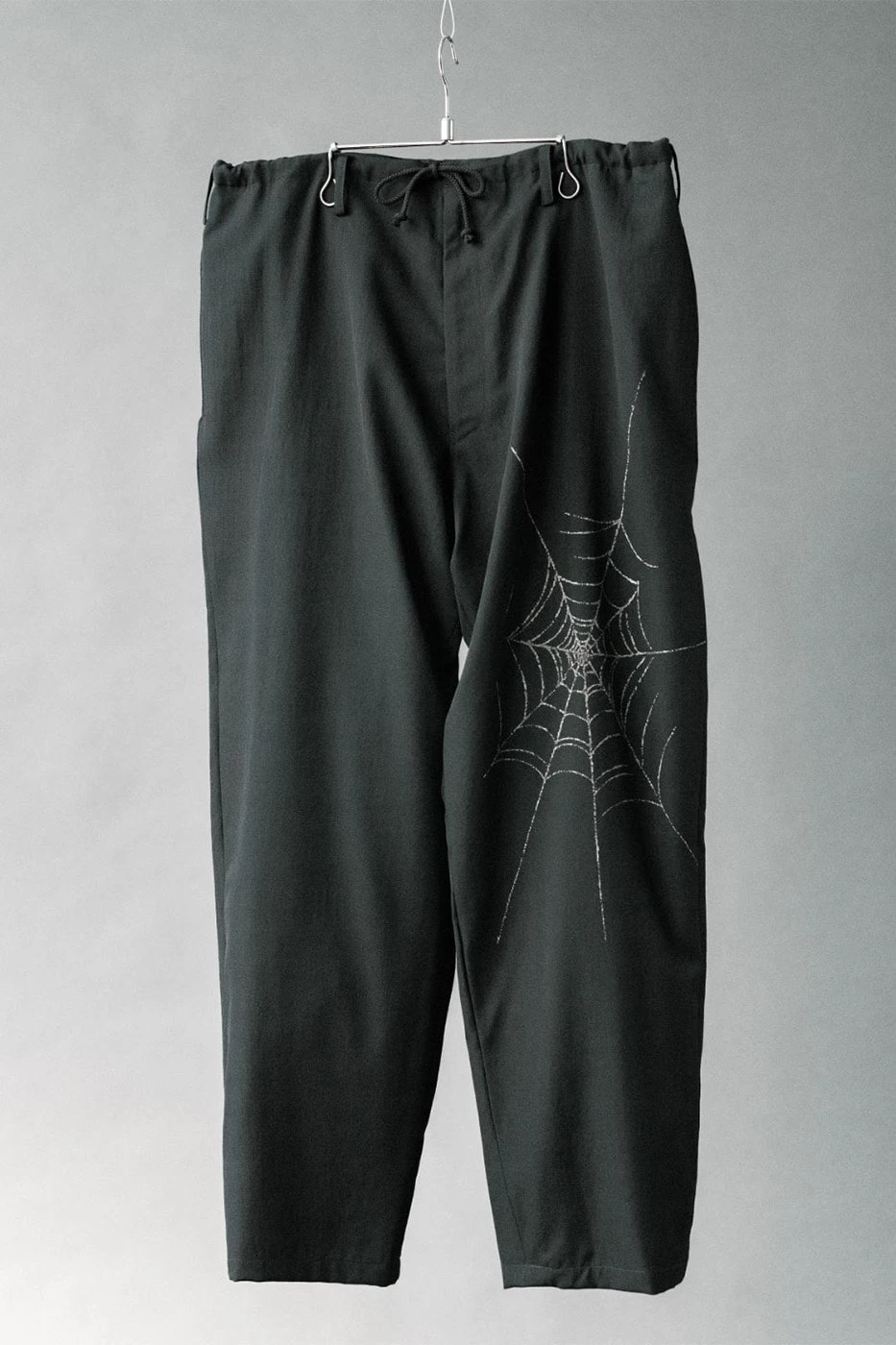 Full capsule lineup shown together, jacket, shirt, and two trousers